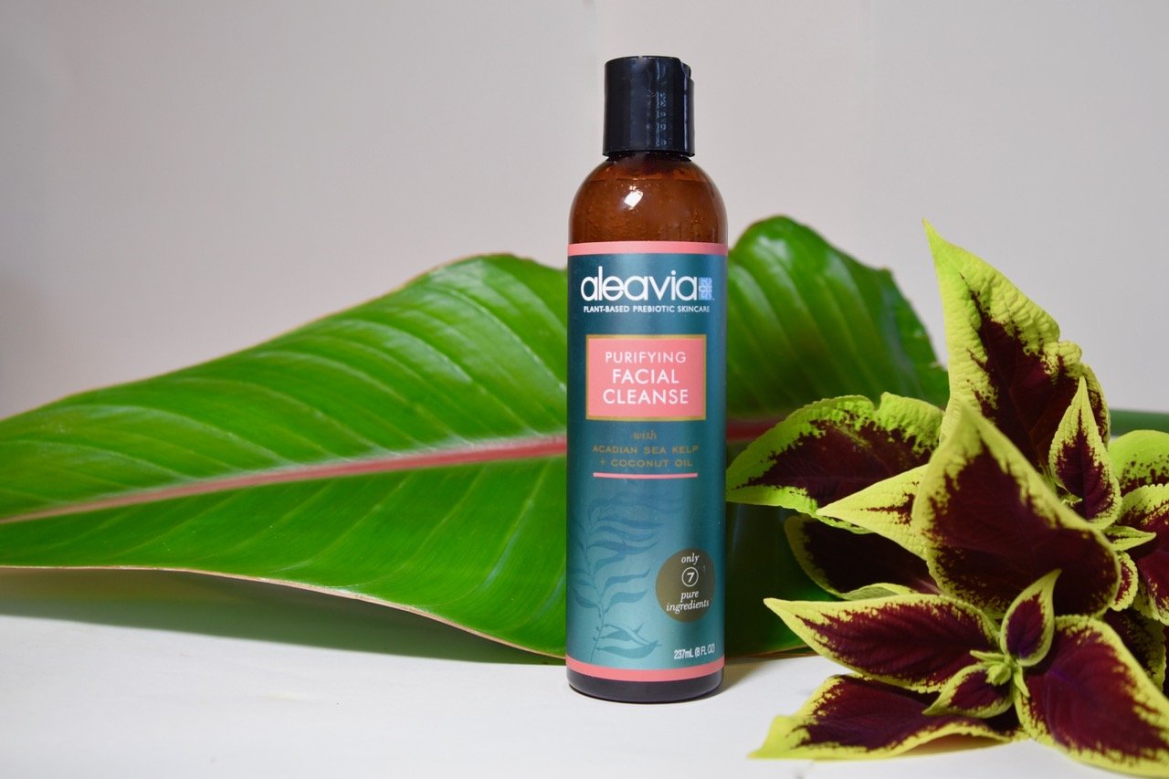 Aleavia purifying facial cleanse next to leaf