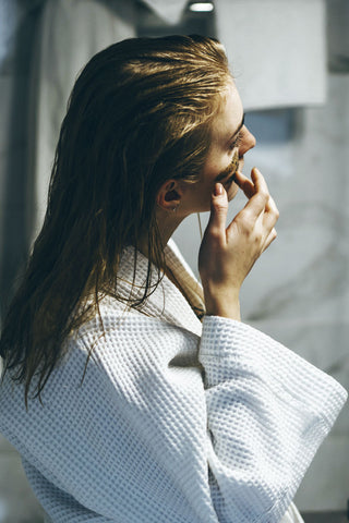 woman applying body scrub