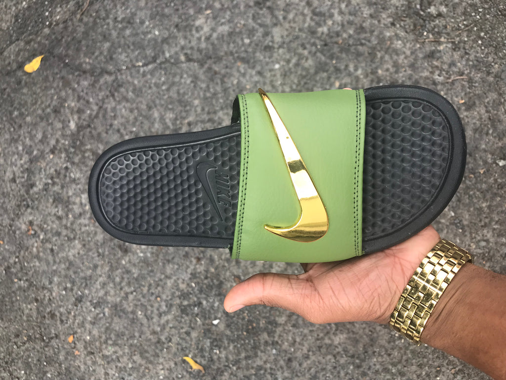 blue nike slides with gold check