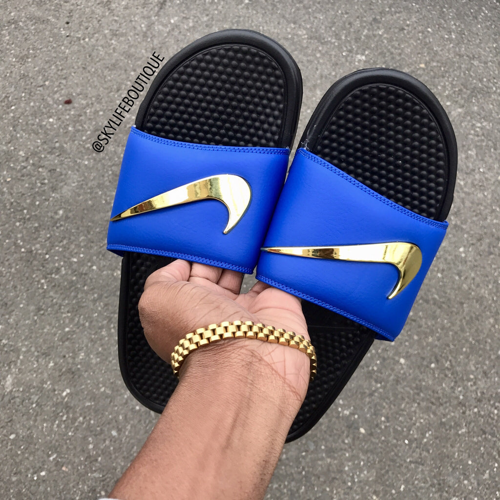 red nike slides with gold swoosh