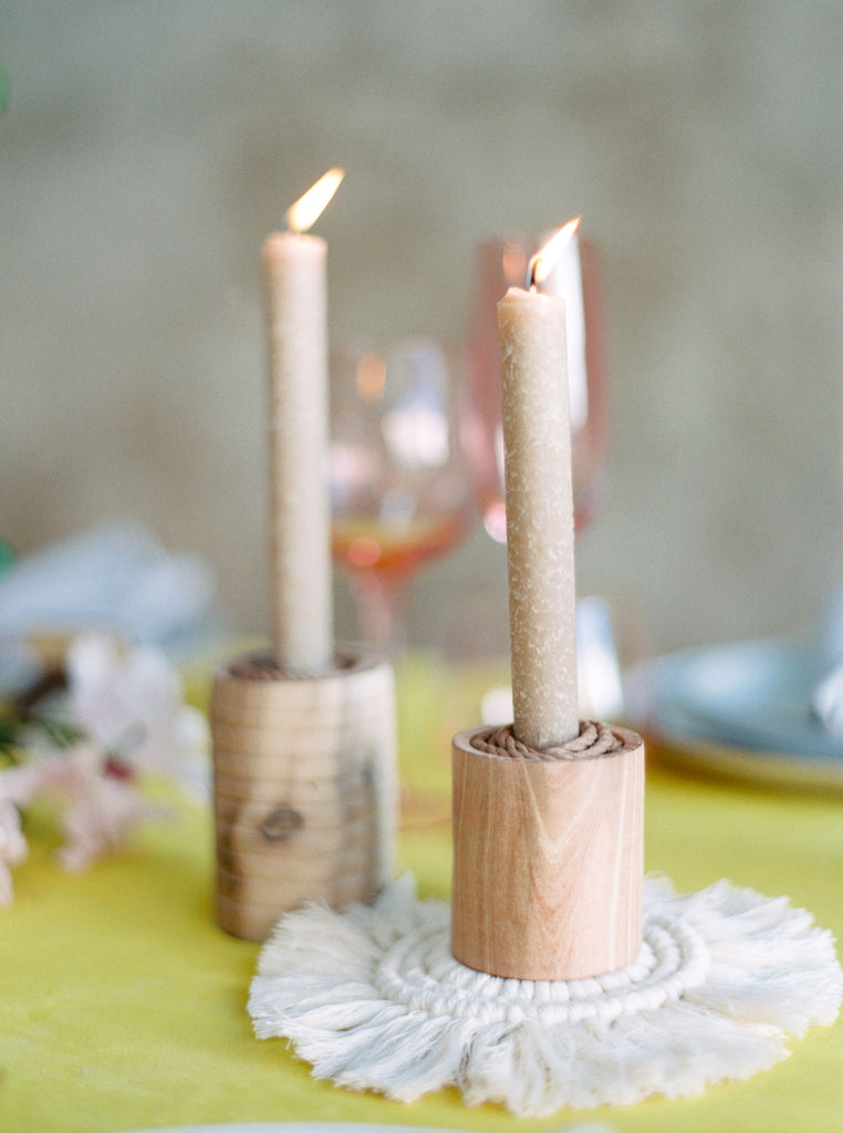 Wedding table settings for an inspired, ethereal macramé wedding with candle sticks 