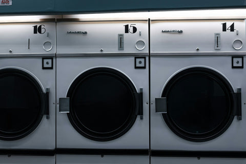 Industrial-size dryers in a hospital laundry room