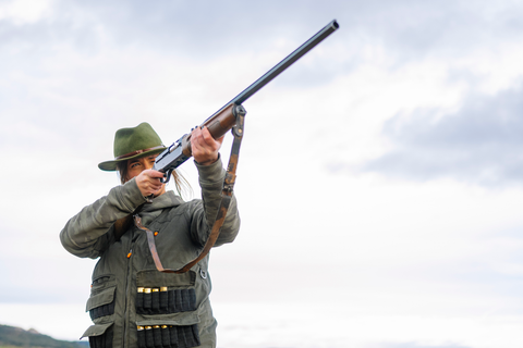 woman aiming with rifle