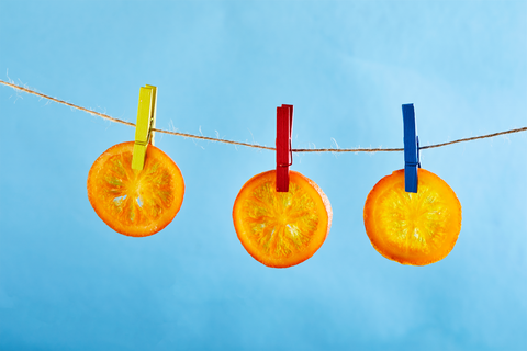 dried orange slices hanging on clothing line