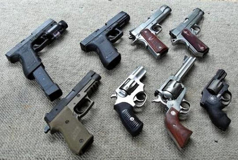 variety of pistols and handguns