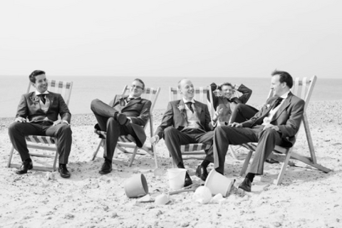 ushers at beach in suits ties pocket square dickie bow wedding blog