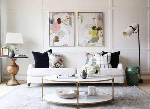 White sofa with round gold rimmed coffee table