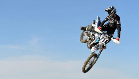 WP Suspension Rider Nick Collins Jumping a Dirtbike