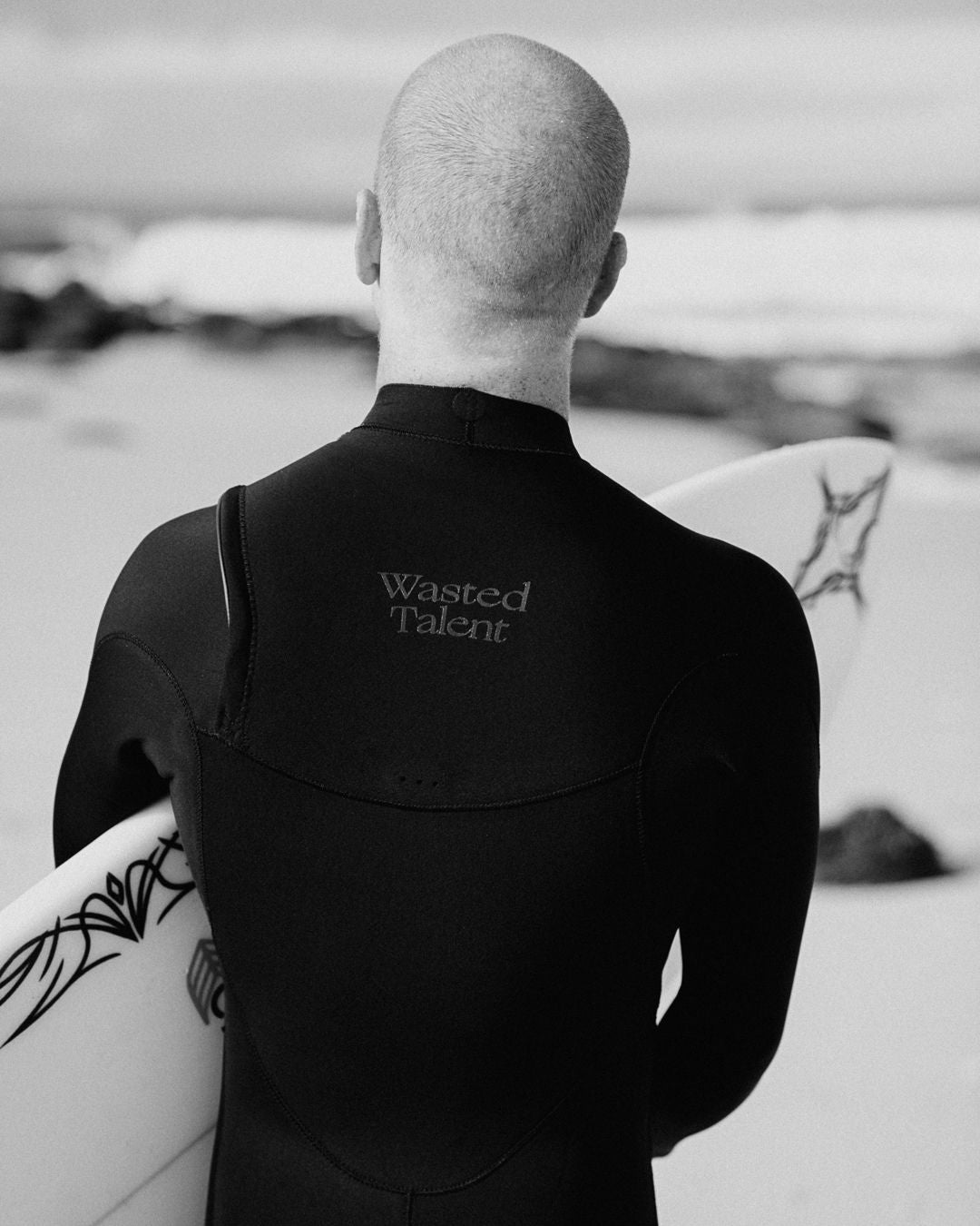 chippa wilson surfing for wasted talent and adelio wetsuits collab
