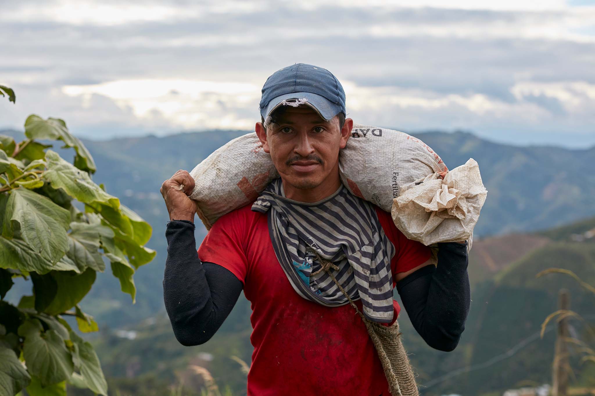 Colombian coffee farmer with sack on his back