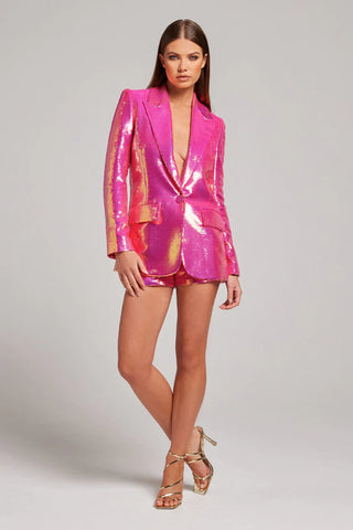 Woman wearing hot pink iridescent sequin blazer