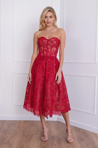 Woman wearing red strapless midi dress with lace detailing