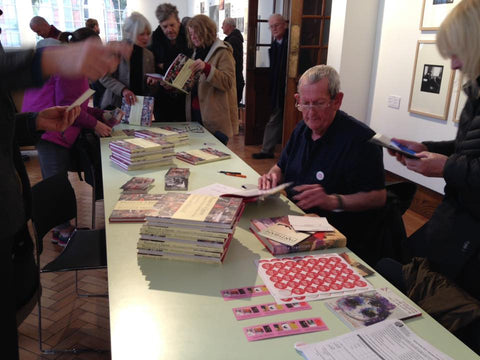 Man signing books.