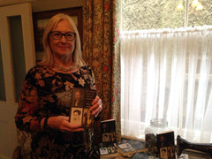 Woman standing with book