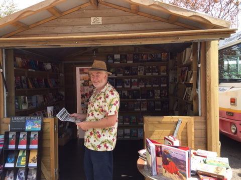 Man standing with newspaper