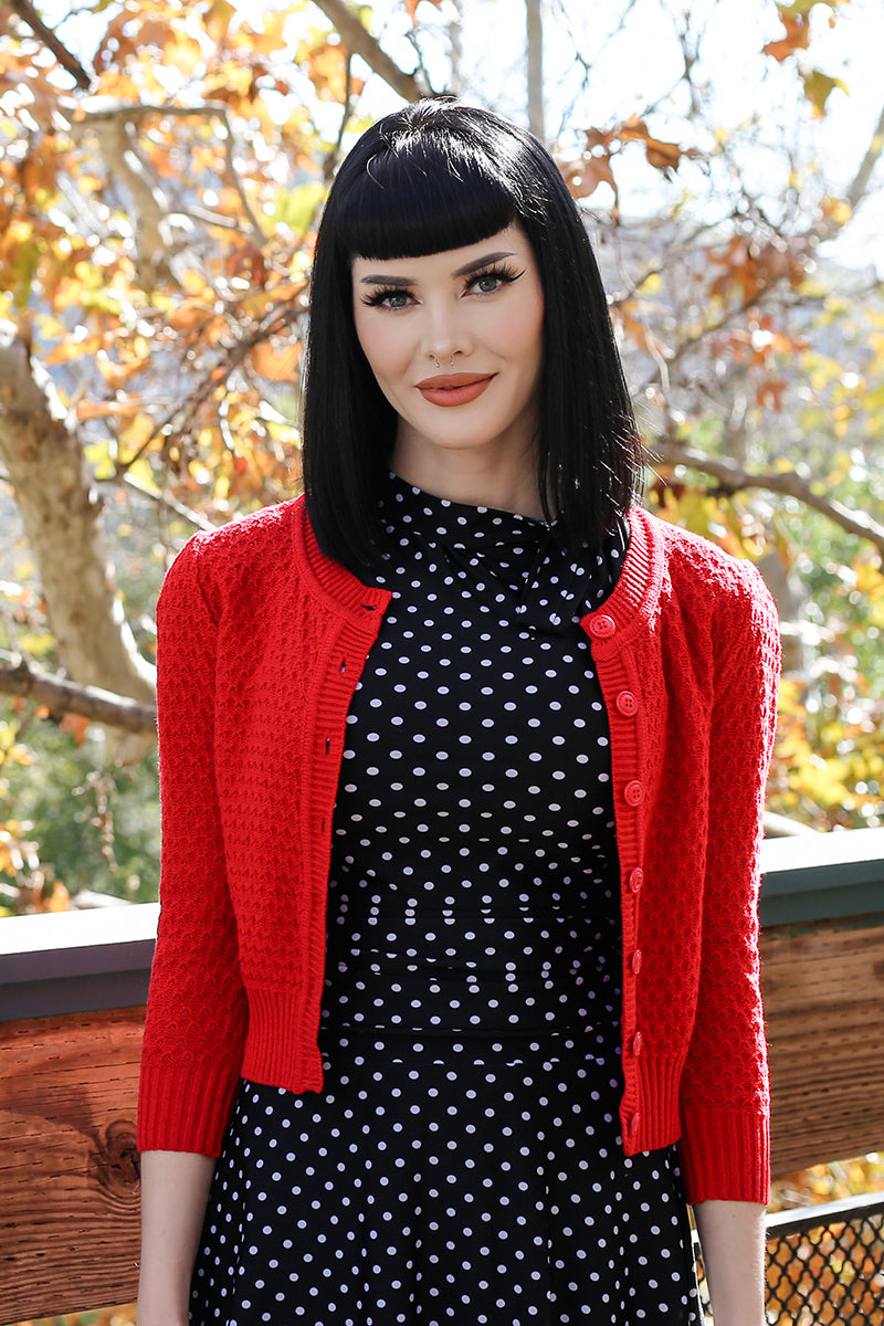 black dress with red cardigan