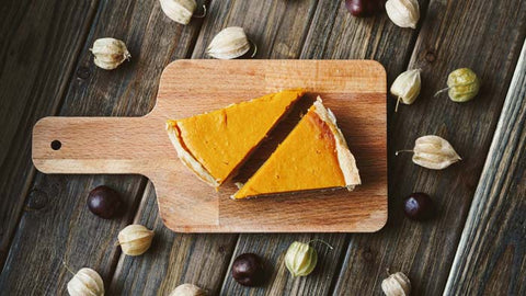 Slices of pumpkin pie on a cutting board