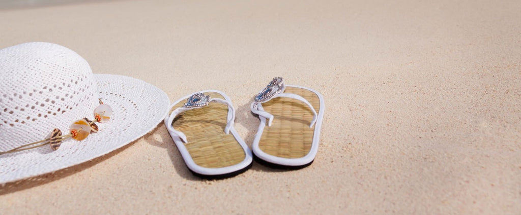 Beach wedding sandals and woven hat
