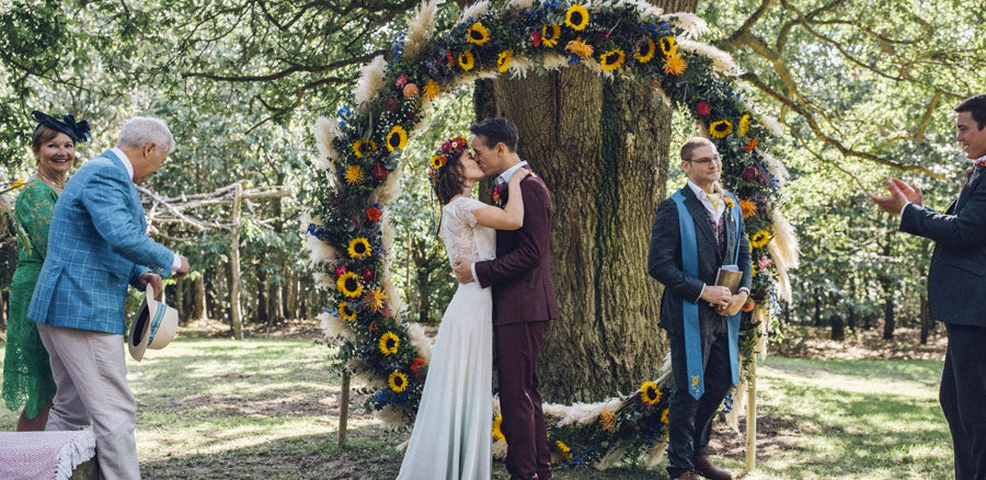 Wreathed Wedding Couple at a Festival Themed Wedding