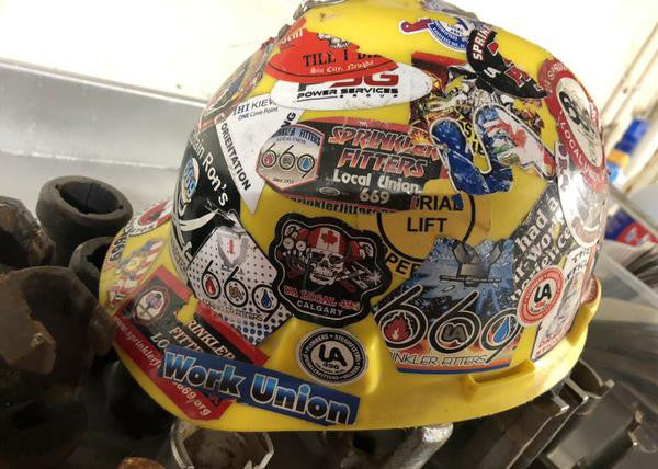 Hard hat covered in stickers