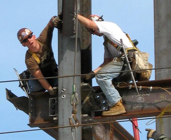 ironworkers on a beam