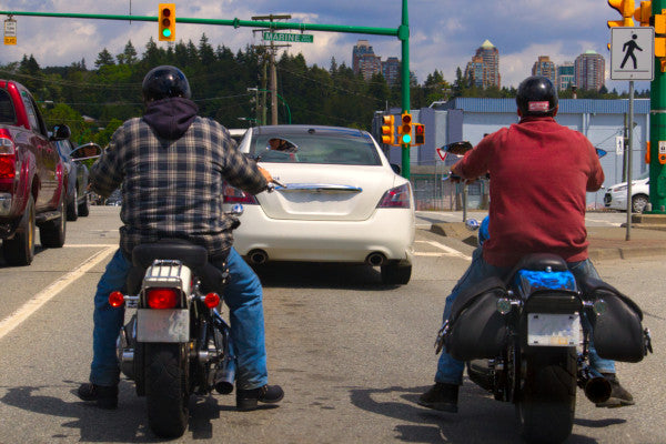 Motorcycle riders with half helmets