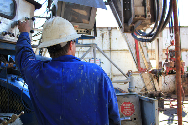 Oil and gas miner wearing a hard hat