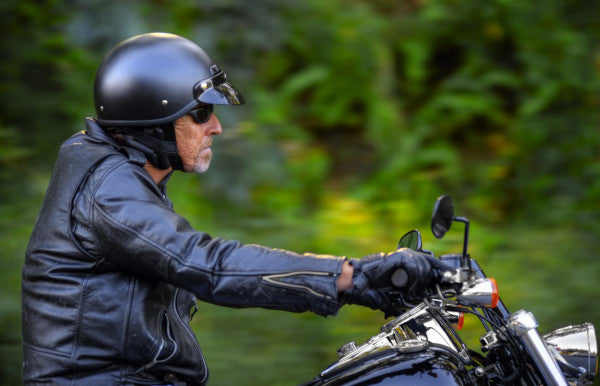 Motorcycle rider wearing open-face helmet