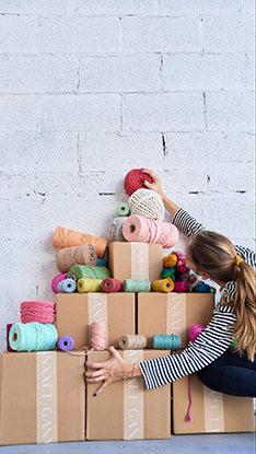 Woman stacking yarn