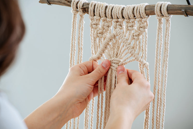 woman doing a half hitch knot