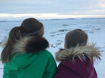 Nunavut kids modelling a hat and Greenlandic muff hand knit by Uyugaqi. Nunavut Qiviut Yarn: 100% Qiviut (Natural Colour), 2 ply, 190 yards/oz, 1.5 ounces each.  Design: Contact Uyugaqi for pattern. (Photo Credit:  Uyugaqi).