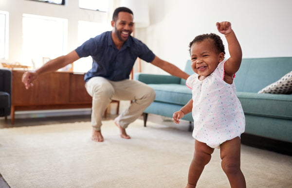 Dad dancing with baby