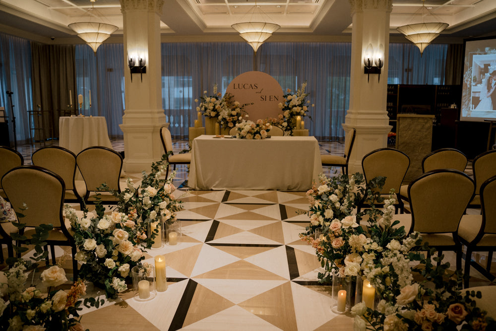 Elegant dome-shaped floral backdrop at Raffles Hotel's Jubilee Hall ballroom