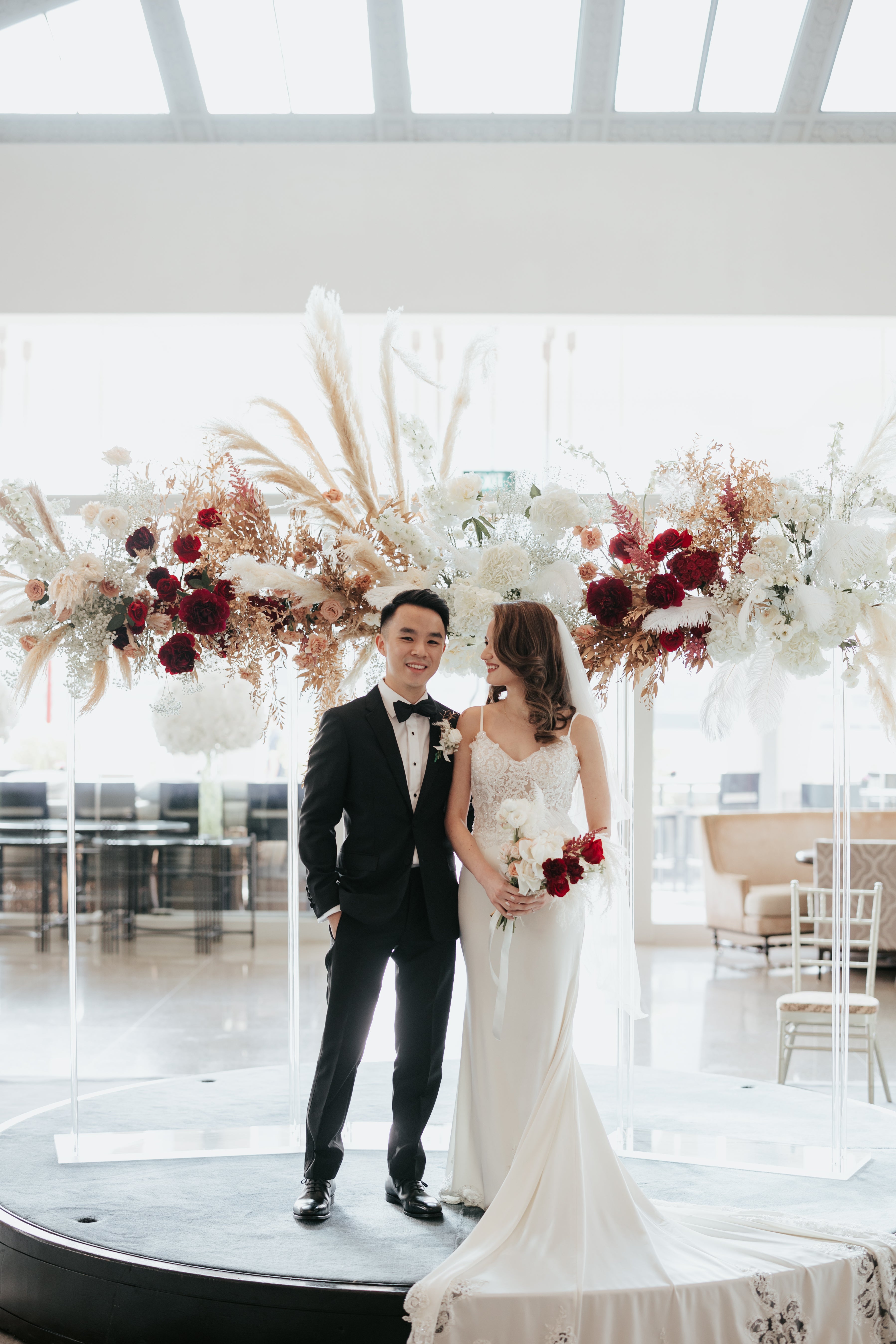Happy wedding couple photoshoot edited with unique floral wedding gown lace