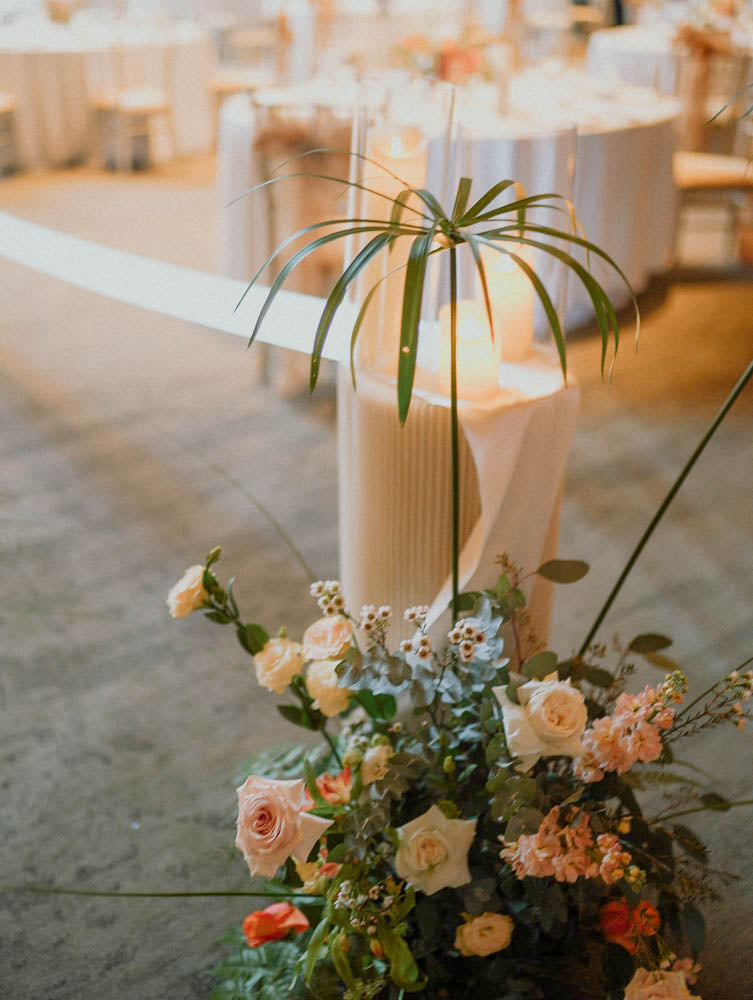 Wild Tropical Botanical Wedding at Capella Singapore. Aisle floral decor hedges with pleated pedestal stands.