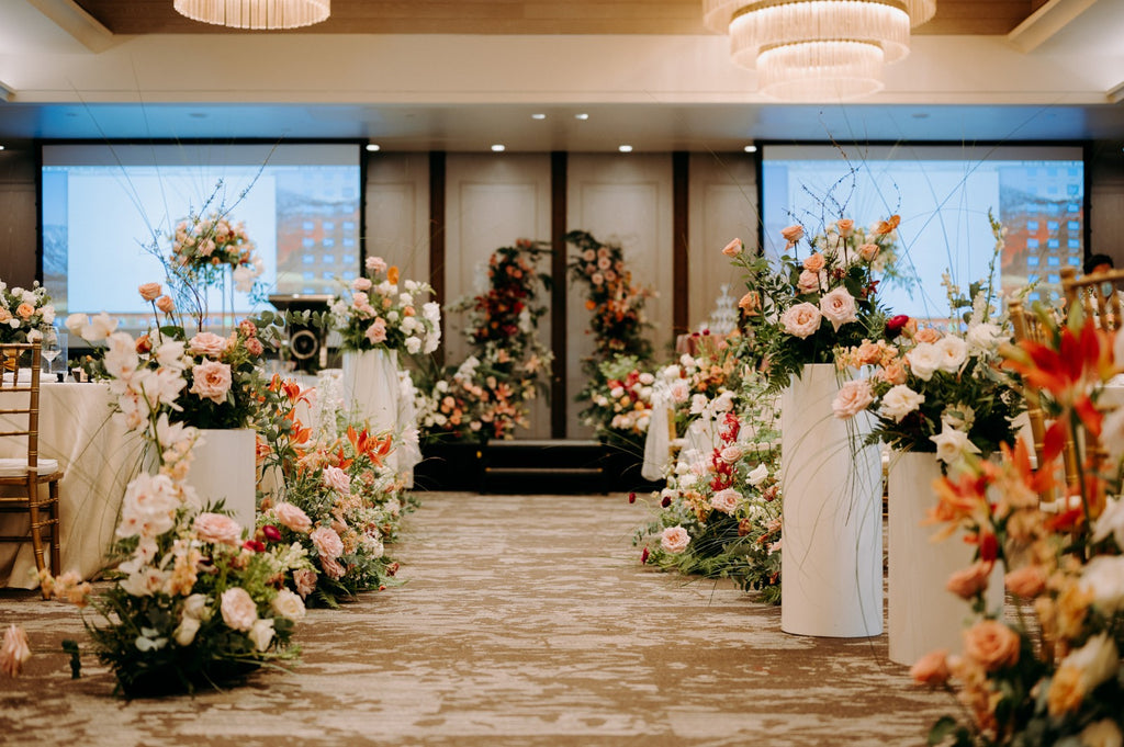 Timeless Burgundy Blush Autumn Color Wedding at Outpost Hotel - Revelry Hall aisle floral hedges decor pleated pedestals