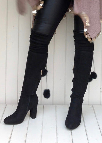 https://www.feathersofitaly.co.uk/products/high-winter-boot-over-the-knee-with-fur-pom-pom-detail-in-black?_pos=2&_sid=625608a3f&_ss=r