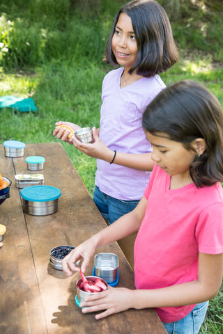 Eco-friendly picnic with stainless steel food containers for kids