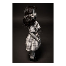 Load image into Gallery viewer, talky tina replica doll with pig tails, wearing a plaid dress with bow around the waist, and black flats with white socks
