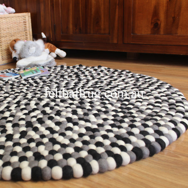black grey and white felt ball rug