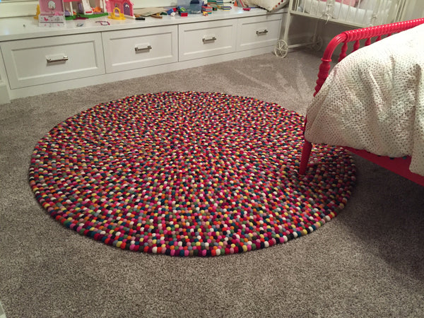 multicolored felt ball rug