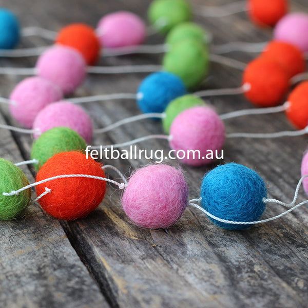 felt ball garland pink red green and blue