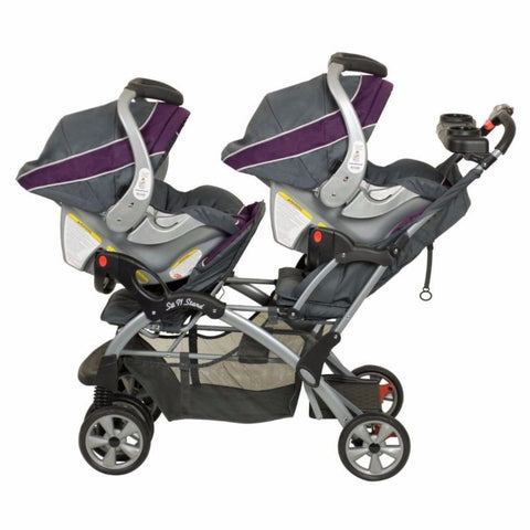 purple infant car seat and stroller