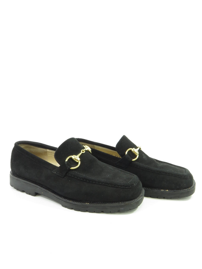 black suede loafers with gold buckle