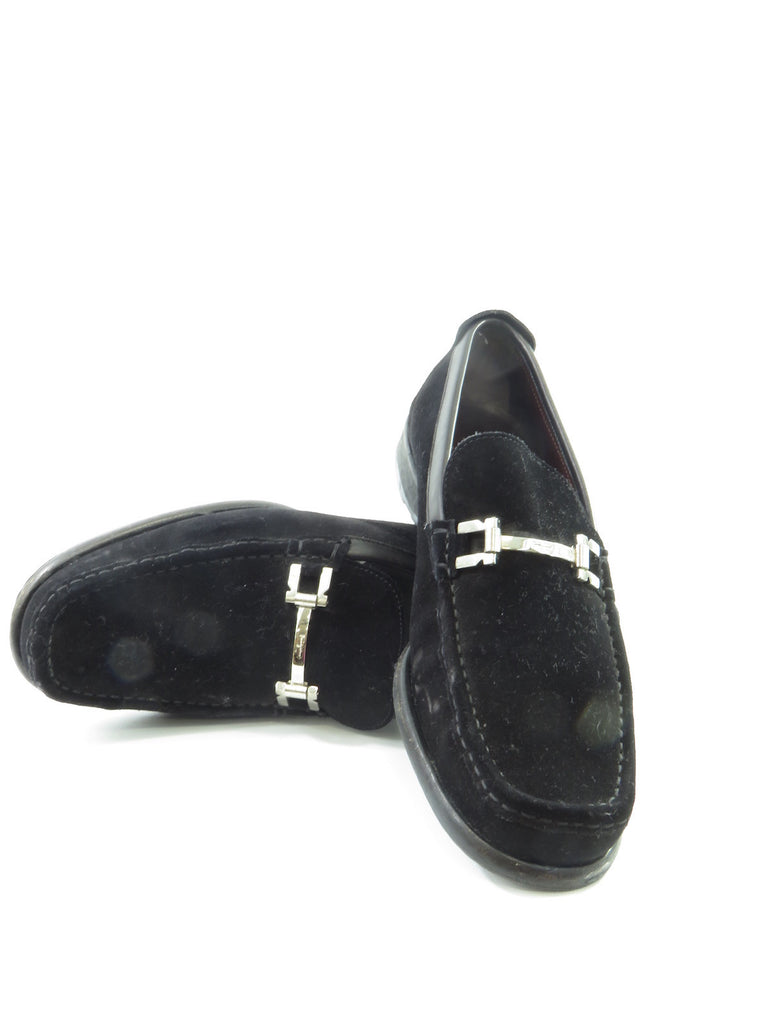 black loafers with silver buckle