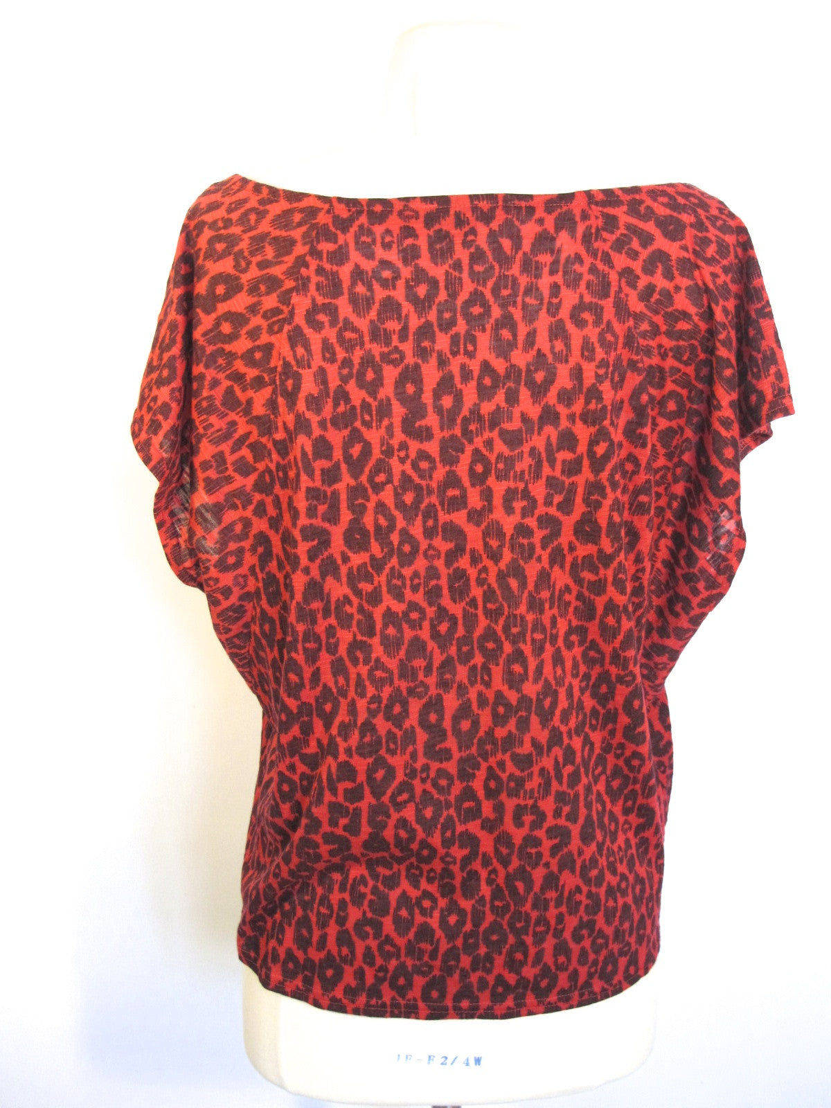 red and black animal print blouse