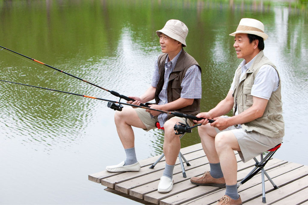 Old man fishing together in a pond