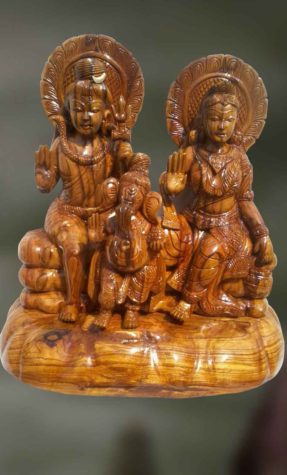 Wood sculpture of Lord Shiva and Goddess Parvati blessing ...