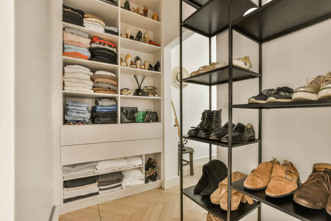 a closet with shelves filled with shoes stored for the next season