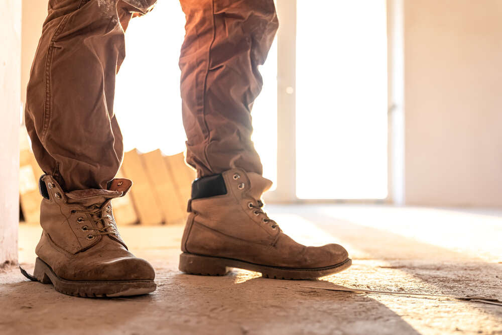 Man is trying his new work boots